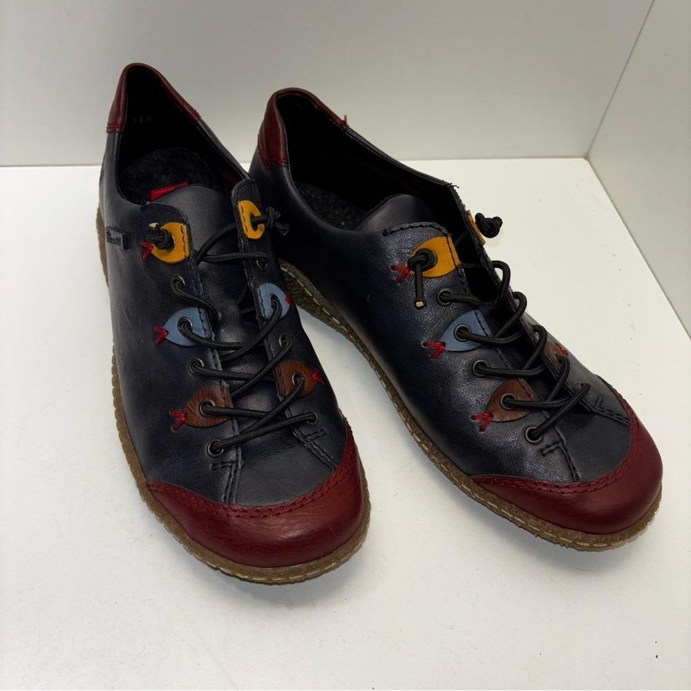 Rieker Liv 61 (L7561) sneakers in navy blue, red, and brown color block